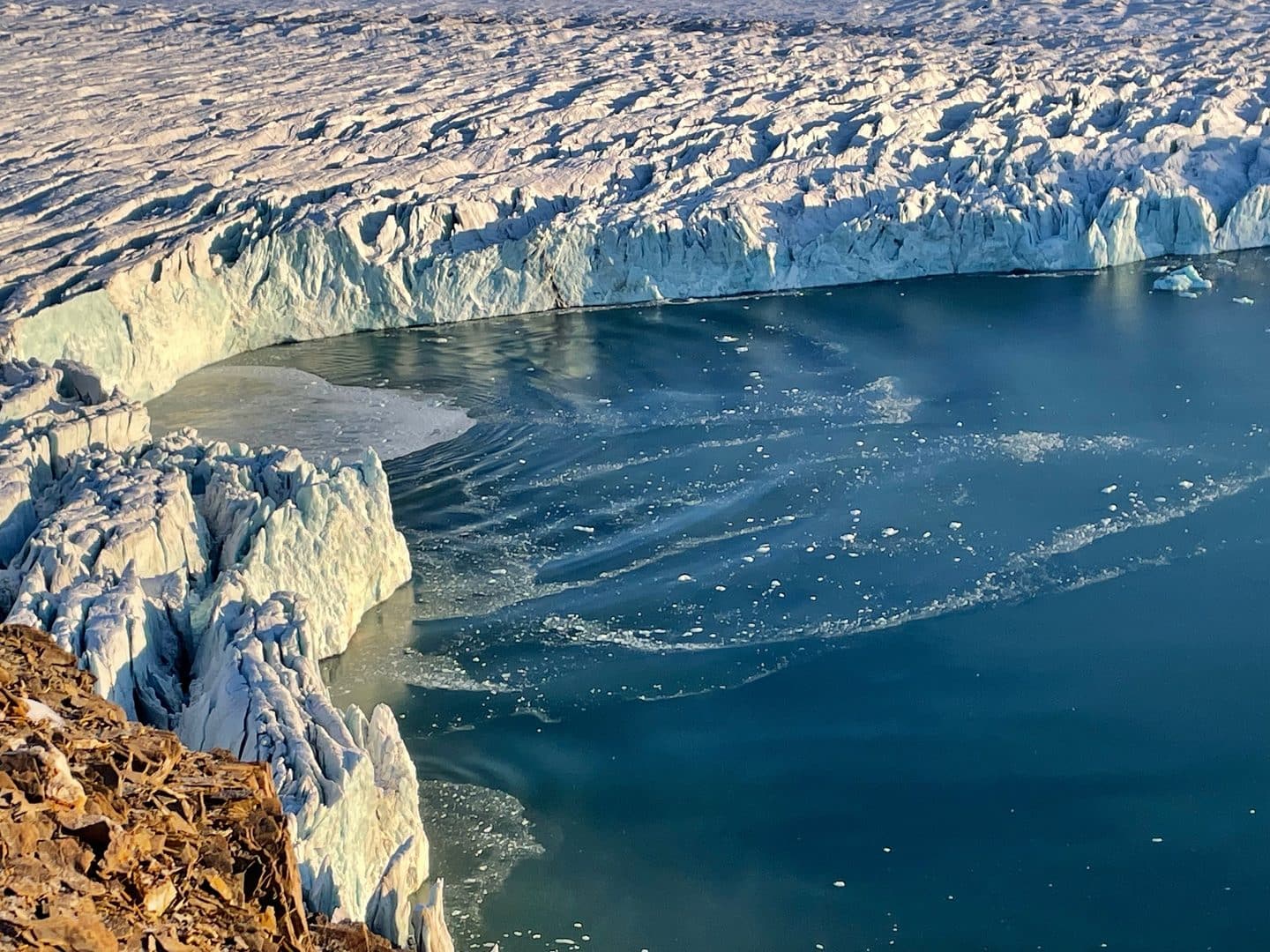 a glacier with a body of water